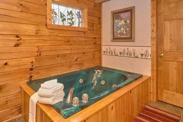 Pamper yourself in this cabin rental's large jacuzzi tub.
